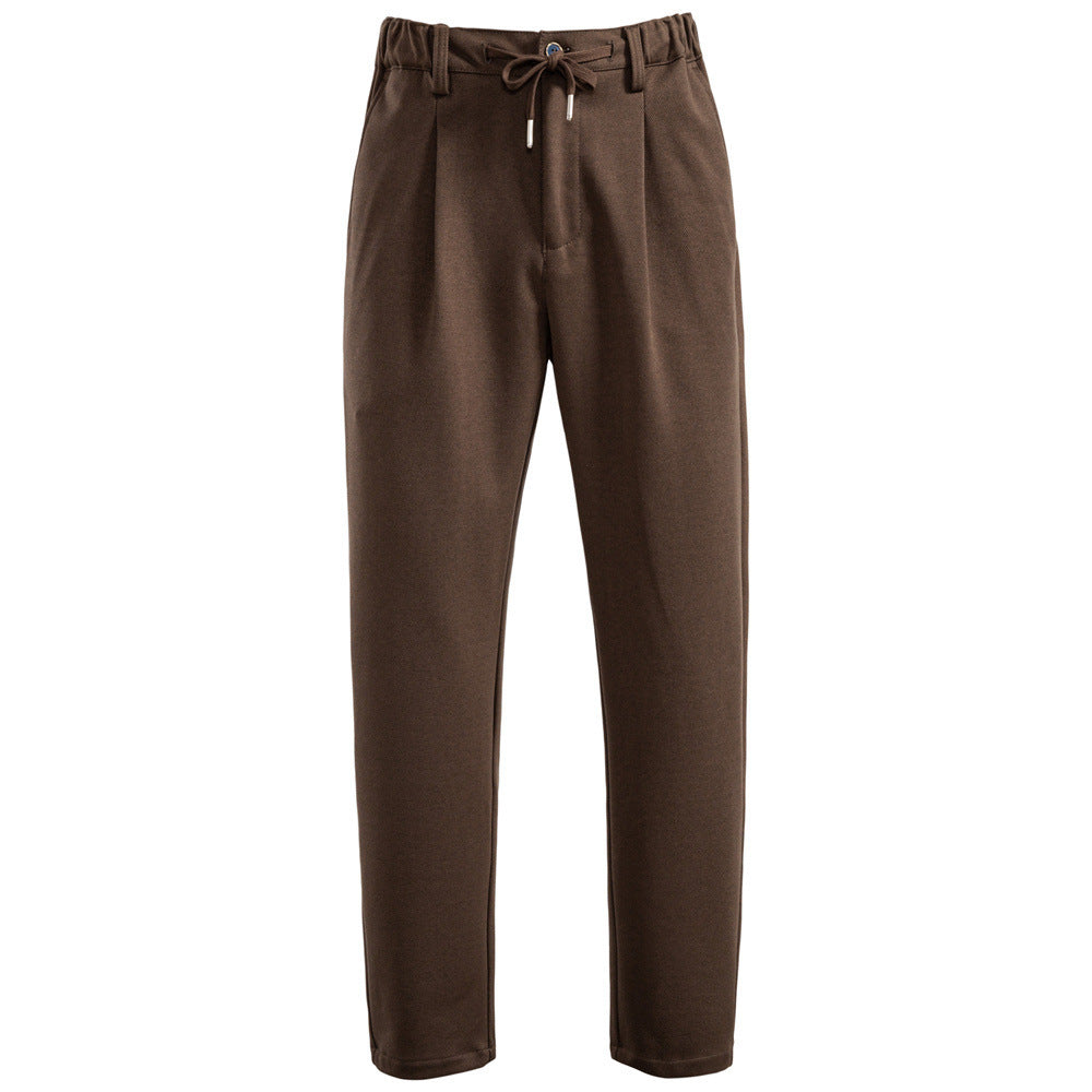 Men's pleated jogger-style trousers with drawstring, belt loops, and tapered cut StylebySassy