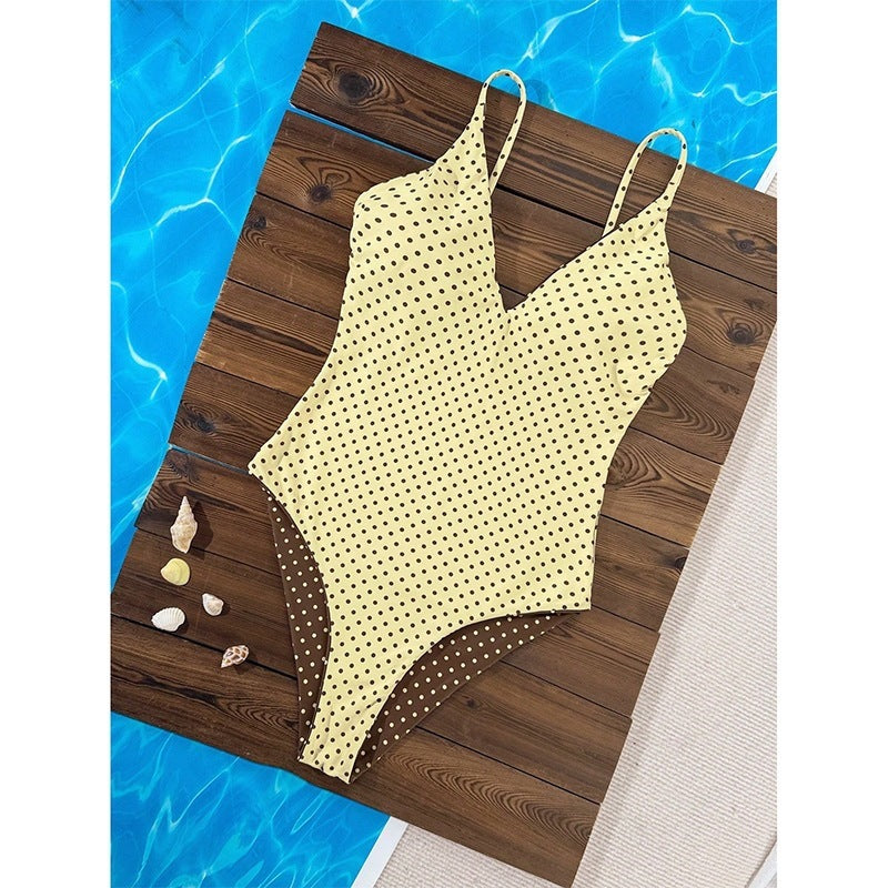Women's one-piece swimsuit with deep V-neckline and decorative dots StylebySassy