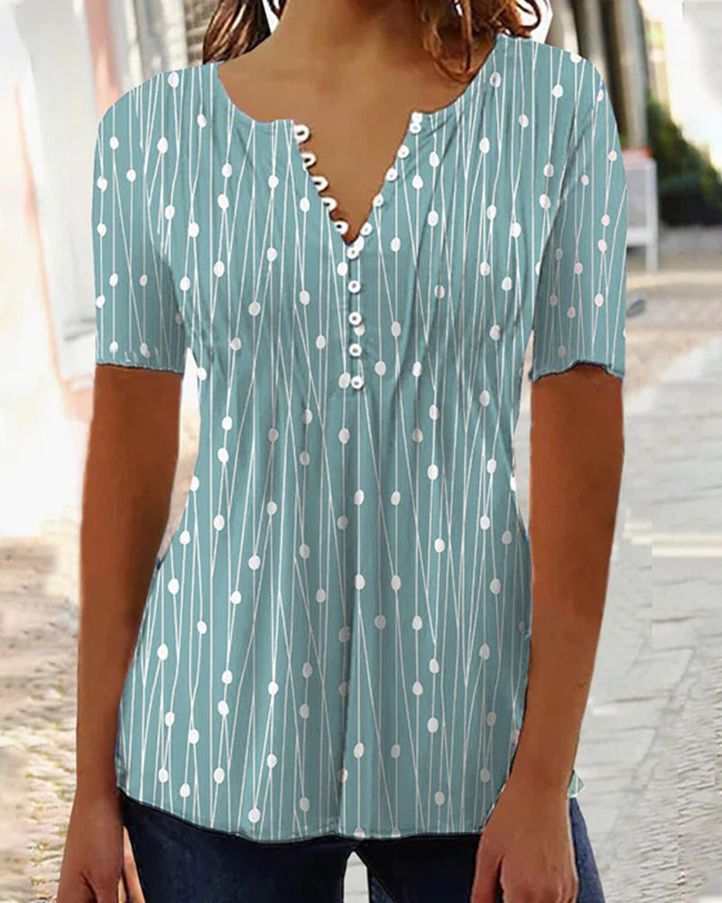 Women's airy V-neck blouse with short sleeves, decorative button placket and graphic dot stripe pattern StylebySassy