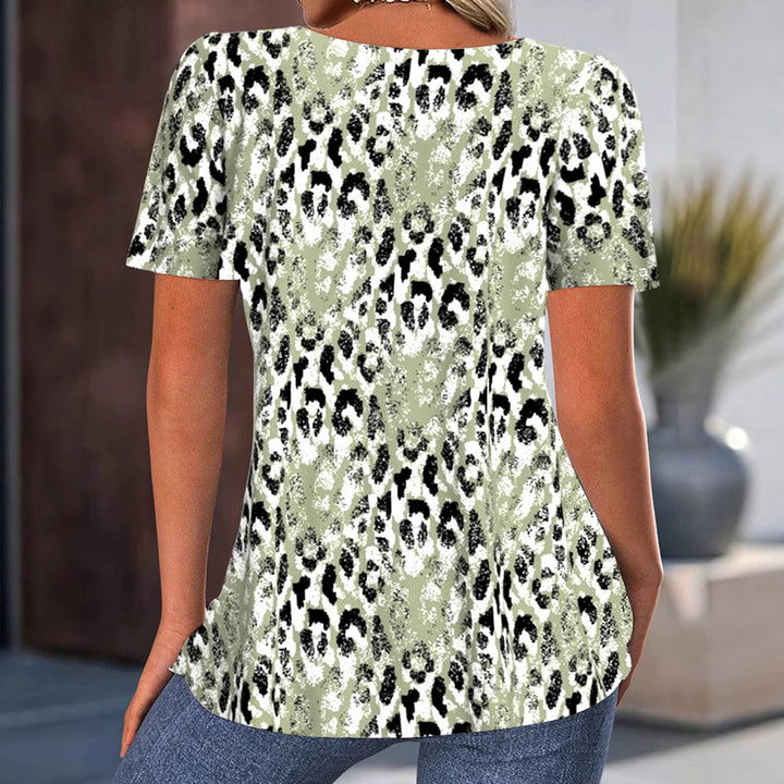 Women loose-fitting short-sleeve blouse shirt with round neckline, bust pleats, and abstract leopard pattern StylebySassy