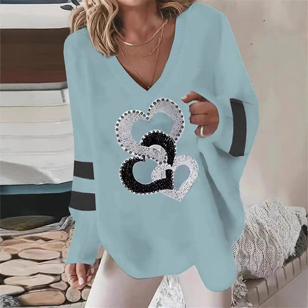 Women's oversized knitted sweater with deep neckline sequin heart and contrast sleeve stripes StylebySassy