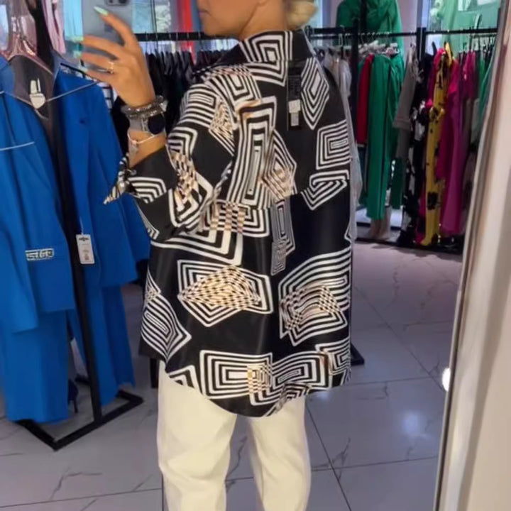Women’s loose silk-look blouse with graphic square print, asymmetrical hem and mother-of-pearl button placket StylebySassy