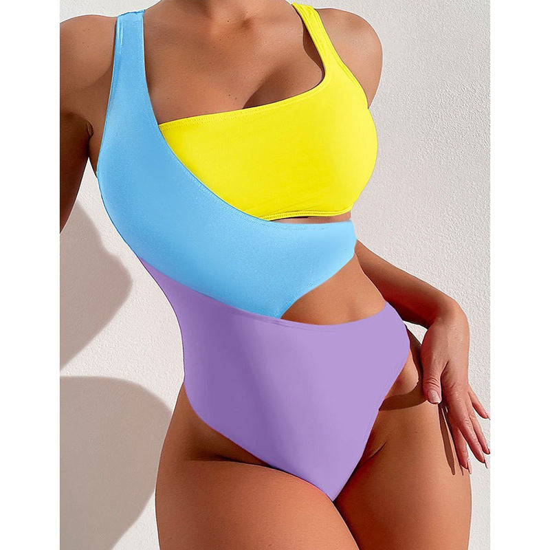 Women's one-piece swimsuit with asymmetric design and colorful contrast areas StylebySassy