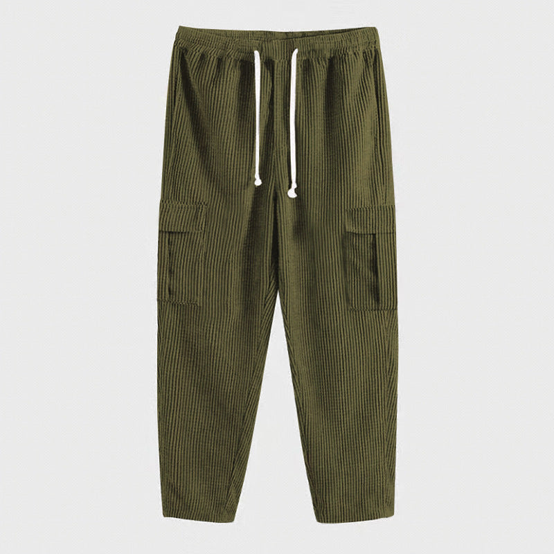 Men's corduroy jogger-style pants with elastic drawstring waistband, flap cargo pockets, and tapered leg StylebySassy