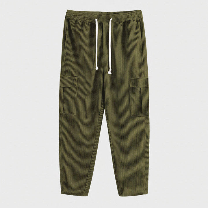 Men's corduroy jogger-style pants with elastic drawstring waistband, flap cargo pockets, and tapered leg StylebySassy