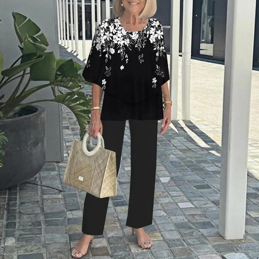 Women's layered tunic with cape sleeves and ankle-length straight leg pants with graphic print StylebySassy