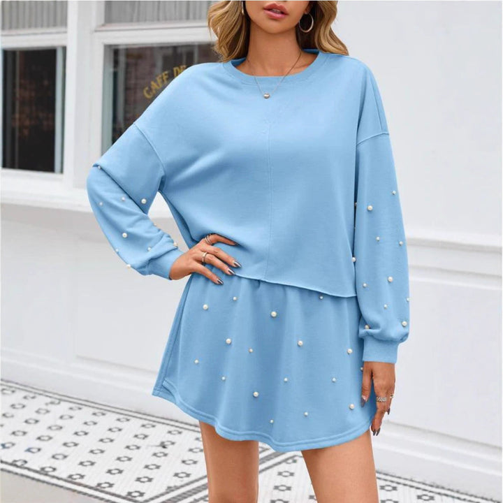 Ladies nan pearl-embellished sweat set with oversized sweater and flared mini skirt StylebySassy