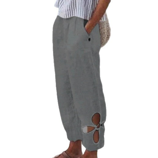 Women's ankle-length culotte pants with elastic waistband, side pockets, and floral hem cutout StylebySassy