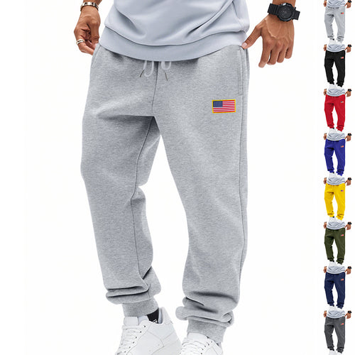 Men's slim-fit sweatpants with tapered leg, elastic drawstring waistband, and discreet flag application StylebySassy