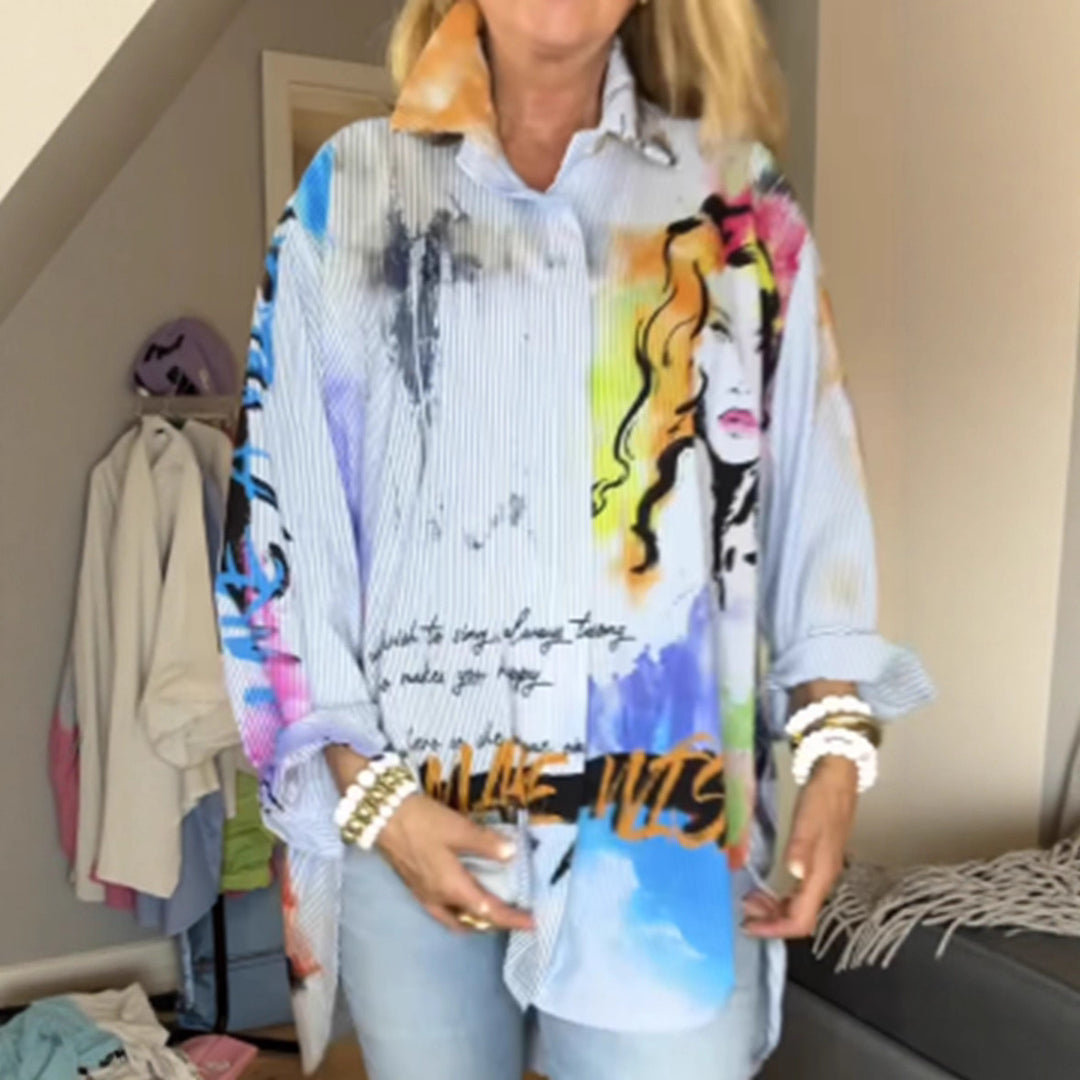 Ladies loose-fitting shirt blouse with artistic graffiti print, fine pinstripe texture and extended hem StylebySassy