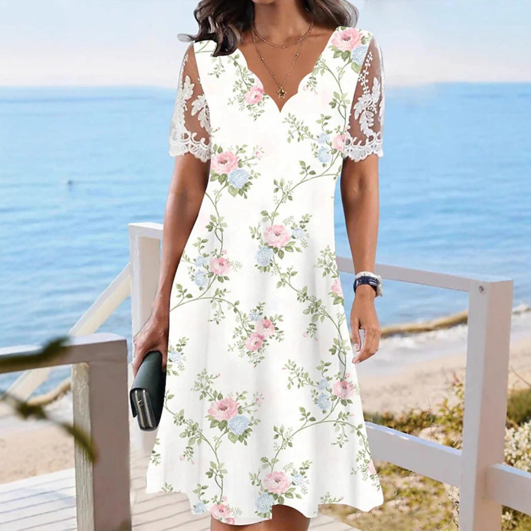 Ladies flowing midi beach dress with wavy V-neck and sheer lace sleeves StylebySassy