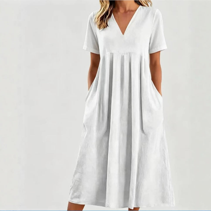 Women nan legeres V-neck midi dress with side pockets and gathered empire seam StylebySassy