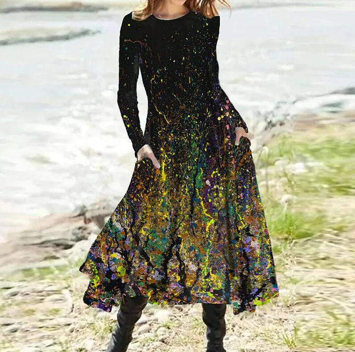 Women's A-line midi dress with abstract spray pattern, round neckline, long sleeves and side pockets StylebySassy