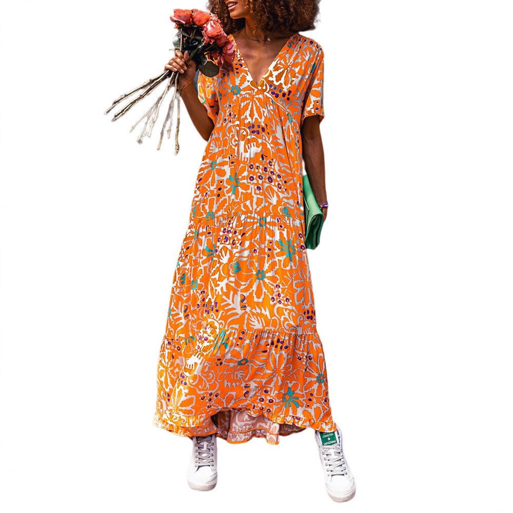 Women’s ankle-length V-neck maxi dress with graphic ethnic print, short sleeves and flared ruffle hem StylebySassy