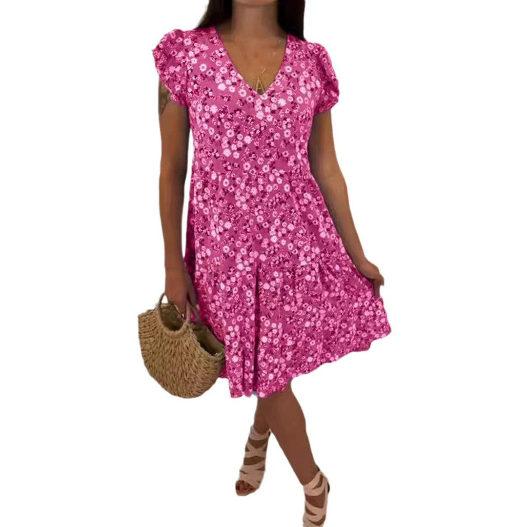 Women’s V-neck dress with gathered waist seam, short flounce sleeves, and tiered skirt StylebySassy