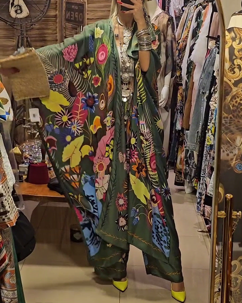 Women's extravagant maxi kaftan two-piece set with wide kimono sleeves, flared palazzo pants, and expressive floral print StylebySassy
