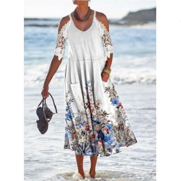 Women’s flowing maxi dress with shoulder cutouts crochet lace sleeves A-line cut and side pockets StylebySassy