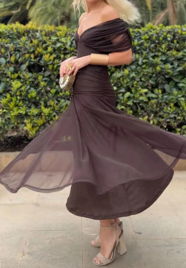 Ladies elegant floor-length evening dress with draped shoulder area and airy chiffon skirt StylebySassy