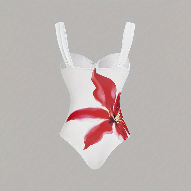 Women's one-piece swimsuit with elegant flower appliqué and draped skirt StylebySassy