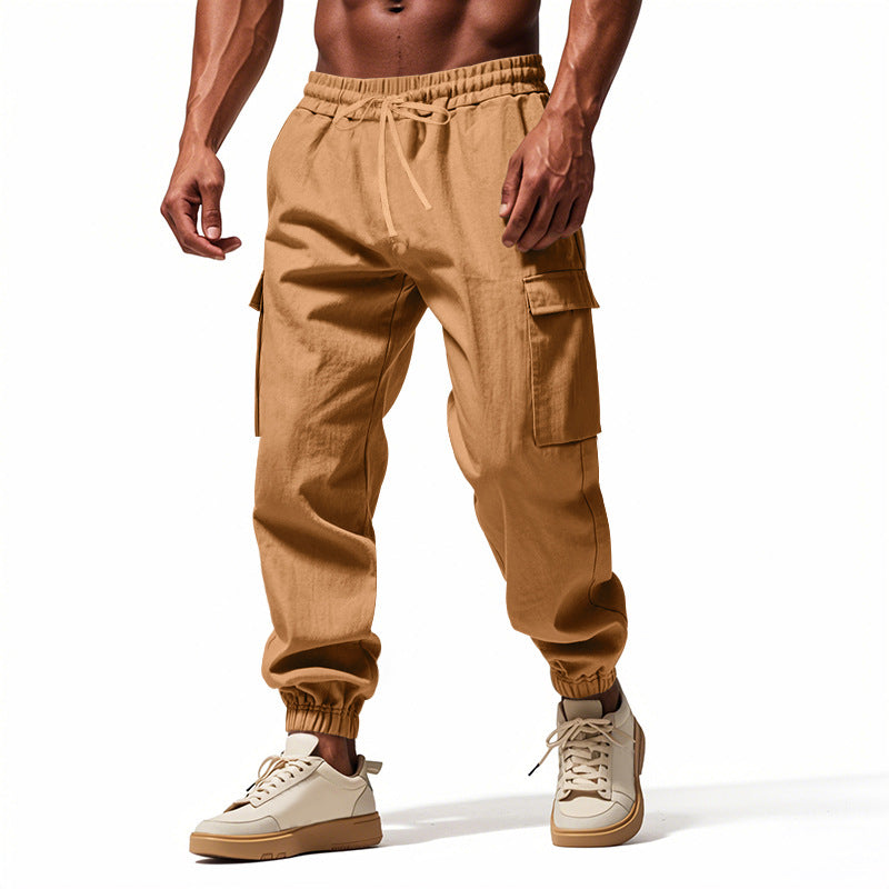 Men's tapered joggers in utilitarian style with elastic waistband, drawstring, and flap pockets StylebySassy