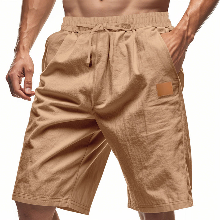 Men's lightweight casual Bermuda shorts with elastic waistband, drawstring and discreet leather application StylebySassy