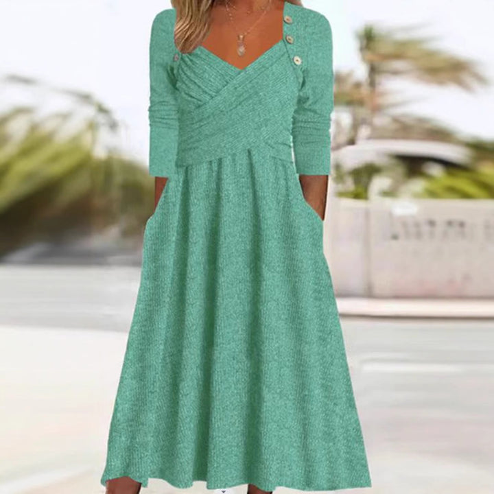 Women's knitted maxi dress with wrap top V-neck, side pockets and decorative button placket StylebySassy