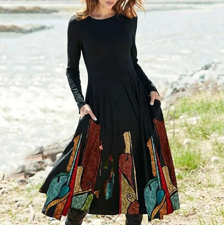 Women's Boho Maxi Dress with tailored empire waist, long sleeves, and side pockets StylebySassy