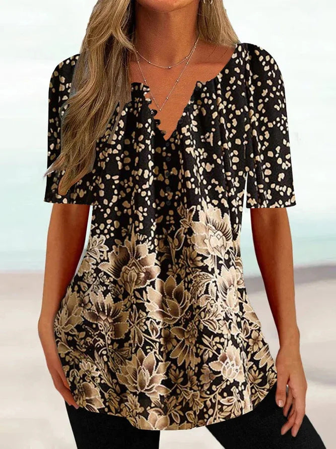 Women’s loose V-neck tunic top with floral trim and polka dot pattern StylebySassy