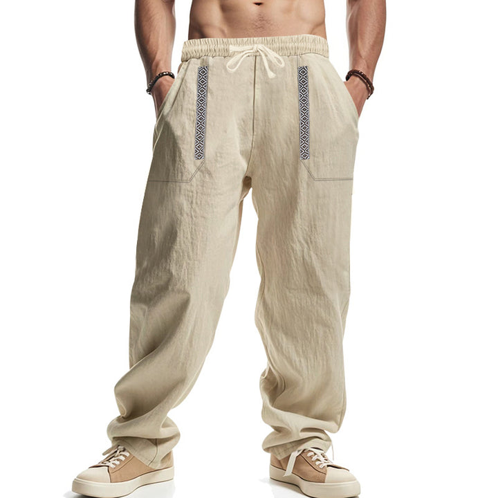 Men's loose-fitting casual pants made of linen blend with elastic waistband, deep side pockets, and ethnic decorative band StylebySassy