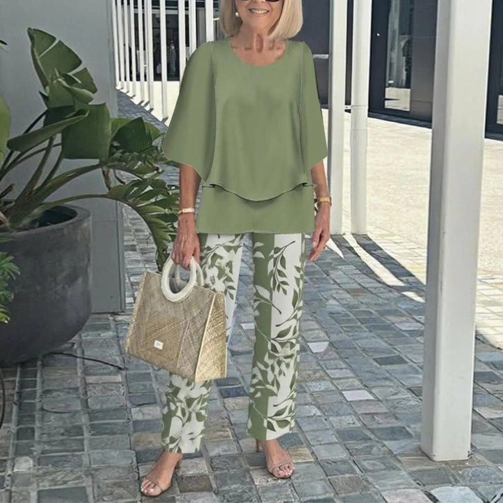 Women's layered tunic with cape sleeves and ankle-length straight leg pants with graphic print StylebySassy