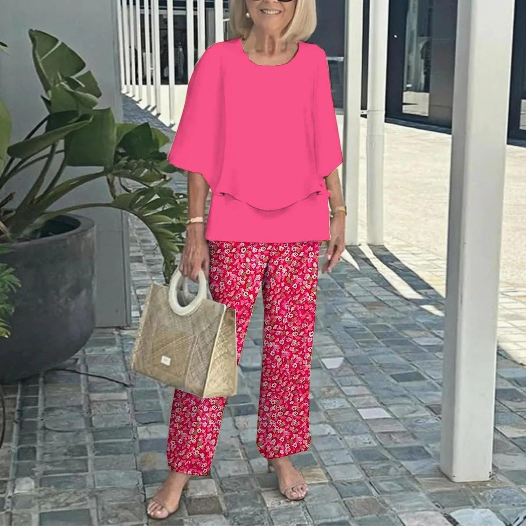 Women's layered tunic with cape sleeves and ankle-length straight leg pants with graphic print StylebySassy