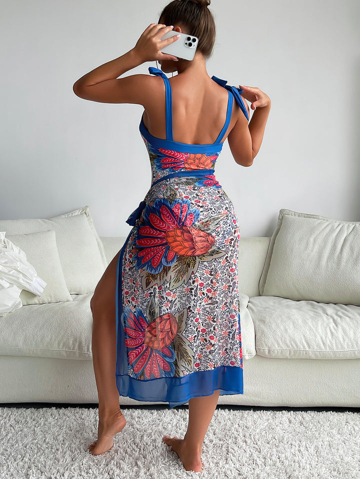 Women's one-piece swimsuit with playful floral design and stylish wrap skirt StylebySassy