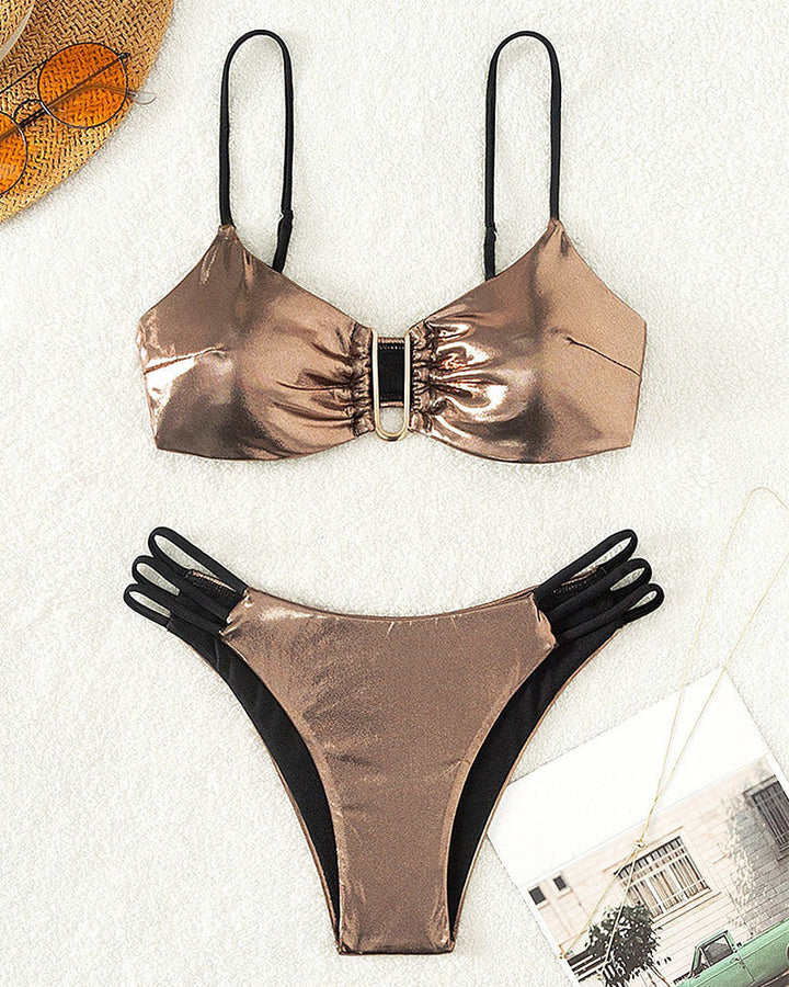 Women's bikini set with intricate lace-up look and golden accents StylebySassy