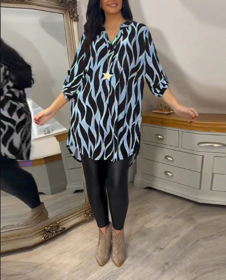 Women's oversized long tunic with abstract wave print, V-neckline and roll-up three-quarter sleeves StylebySassy