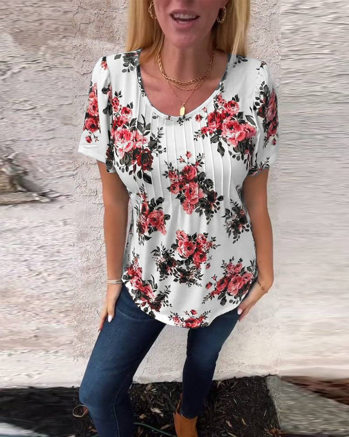 Women's short-sleeve blouse with box pleats, round neckline and floral all-over print StylebySassy