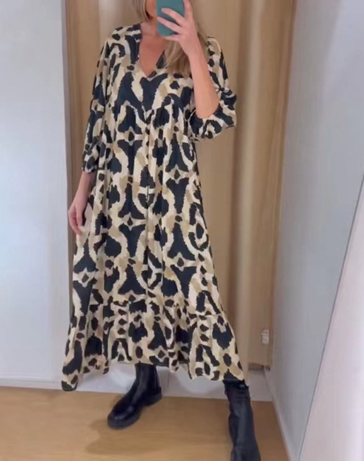 Women's flowing tiered maxi dress with V-neck, gathered bust panel and three-quarter sleeves StylebySassy