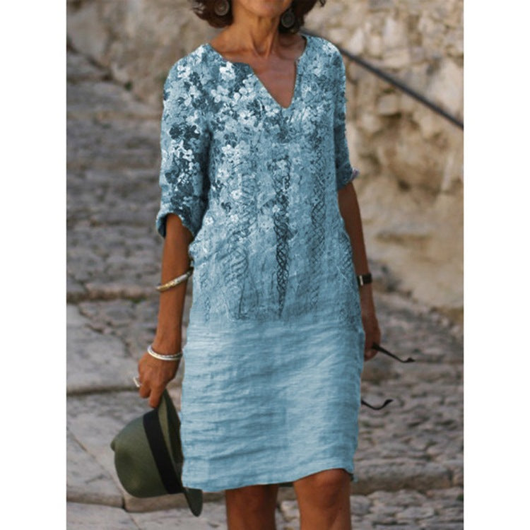 Women's knee-length midi dress in a material mix with floral lace surface, V-neck and crinkle texture StylebySassy