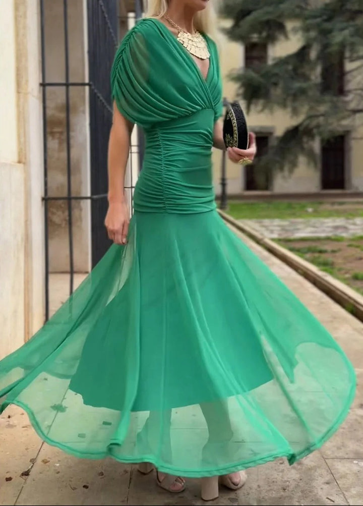 Ladies elegant floor-length evening dress with draped shoulder area and airy chiffon skirt StylebySassy