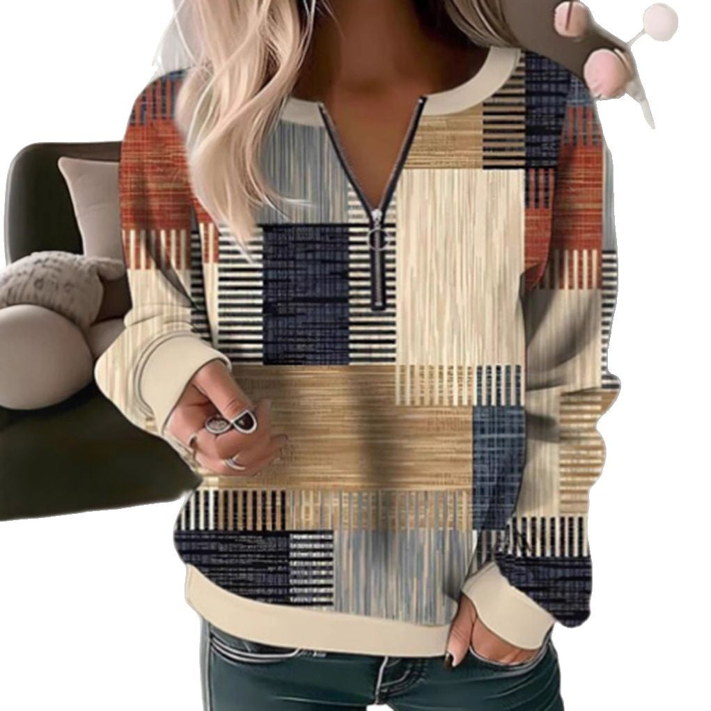 Women's cozy sweater with short zip, graphic patchwork pattern, extended sleeve cuffs, and ribbed hem StylebySassy