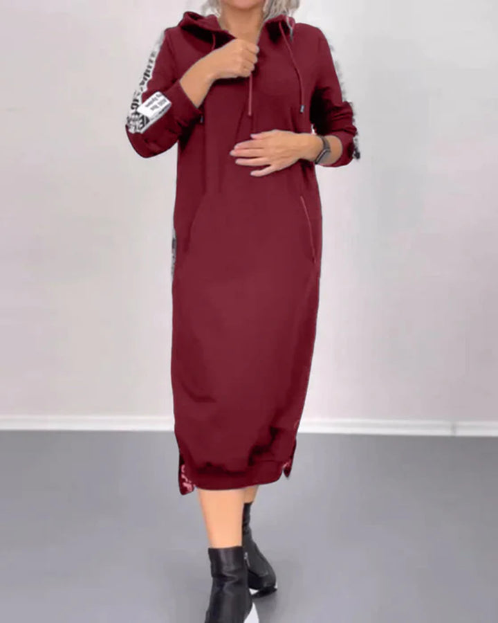 Women's ankle-length hooded sweatshirt dress with half zip, kangaroo pockets and side decorative piping StylebySassy