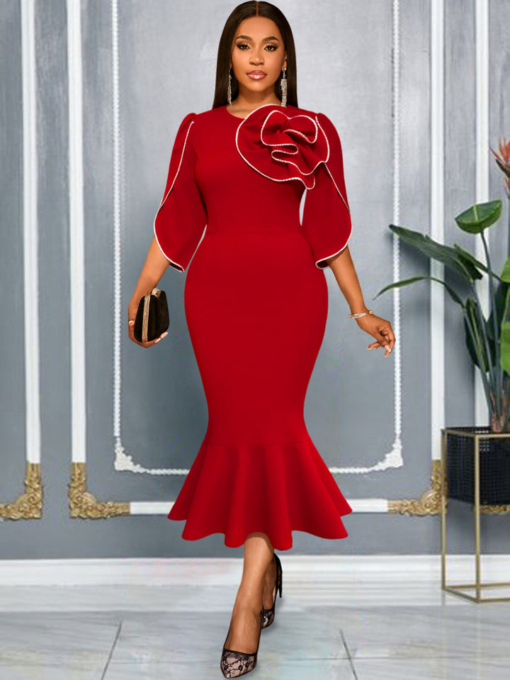 Ladies fitted evening dress with peplum and voluminous ruffle design StylebySassy
