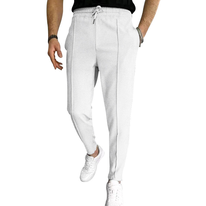 Men's tapered jogging chinos made of structured woven quality with elastic drawstring waistband and decorative crease StylebySassy