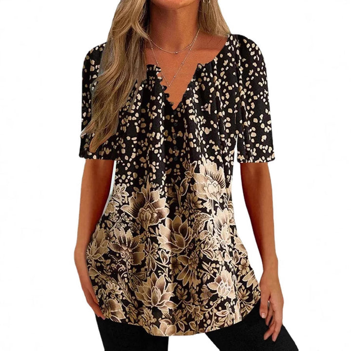 Women’s loose V-neck tunic top with floral trim and polka dot pattern StylebySassy
