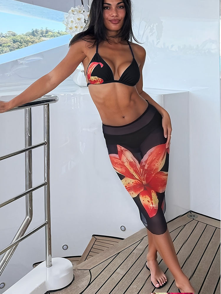 Women's bikini set with floral accents and form-fitting skirt StylebySassy