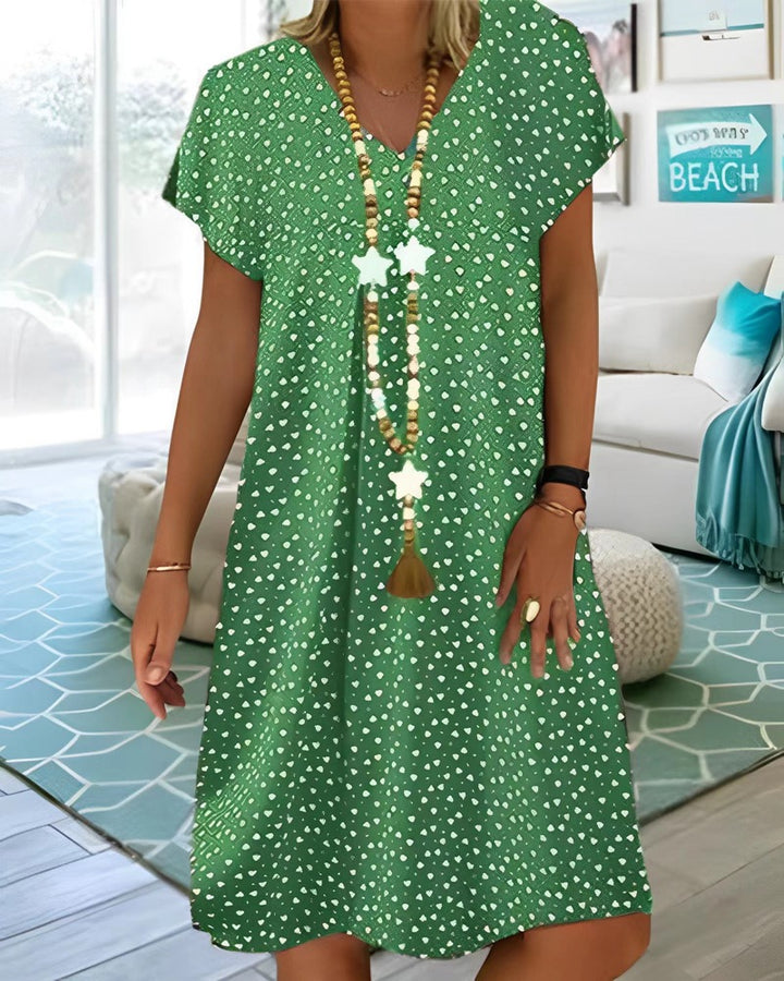 Ladies nan locker falling V-neck short dress with A-line cut, cap sleeves and all-over heart print StylebySassy