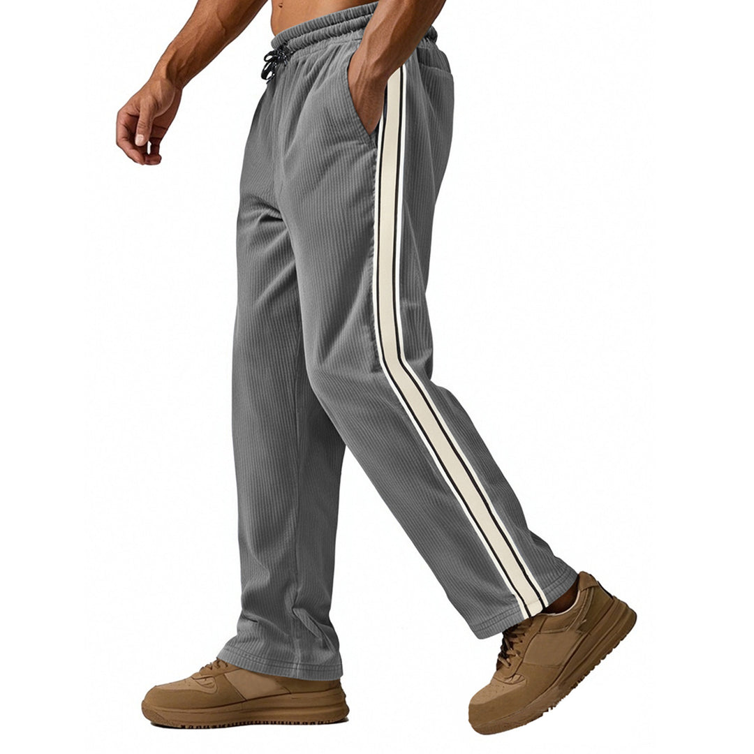 Men's loose training pants in corduroy look with drawstring waistband and side contrast stripes StylebySassy