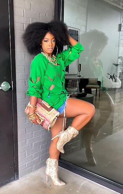 Women's loosely fitted knitted sweater with cut-out details, drawstring, and hip-length silhouette StylebySassy