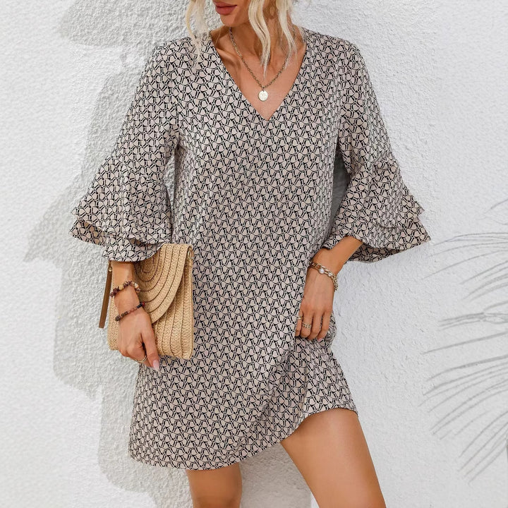 Women's flowing tunic mini dress with V-neck graphic chain pattern and double-layered bell sleeves StylebySassy