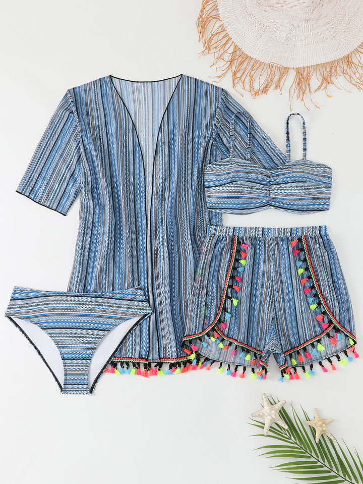 Women's bikini set with colorful wrap skirt and playful pom poms StylebySassy