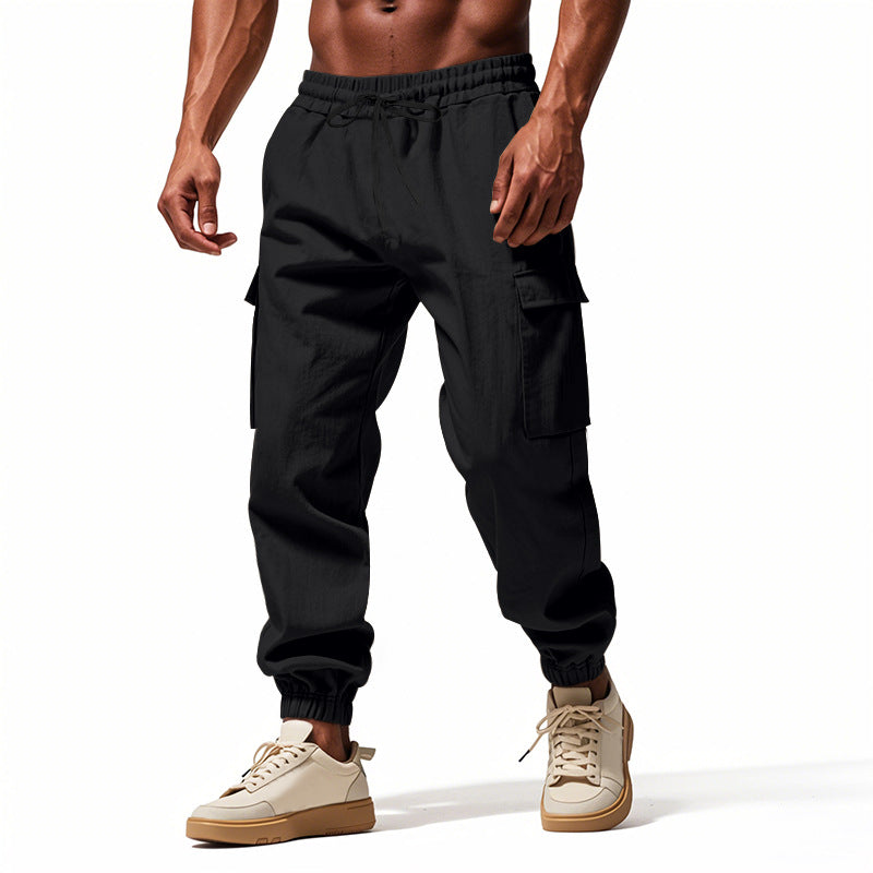 Men's tapered joggers in utilitarian style with elastic waistband, drawstring, and flap pockets StylebySassy